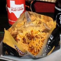 Walking Taco Chili Pie · Frito corn chips, spicy beer chili, cheddar cheese.