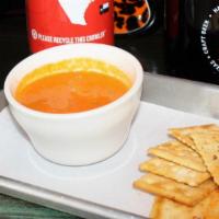 Tomato Soup · Cup of creamy tomato soup.