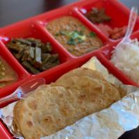 Punjabi Thali · 3 different items, one Dal, one dry vegetable subji and one paneer subji served with rice an...
