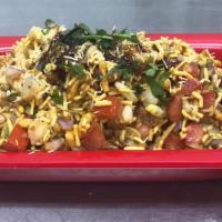 Bhel Puri · crispy sweet and spicy mix of crunchy snacks with nuts, tomatoes, potatoes, chickpeas, onion...
