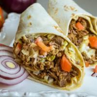 Beef Shawarma Wrap · Lettuce, tomatoes, cucumber, onion, white and red sauce.