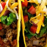 Beef Tacos · Three corn tortillas, onion, tomatoes and taco sauce.