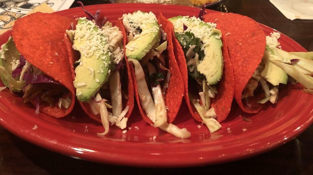Classic Crispy Tacos · Three crispy tacos filled with seasoned taco meat or all white meat shredded chicken topped with lettuce, fresh tomatoes and grated cheese.