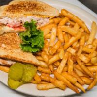 Tuna Melt · Tuna salad with American cheese, bacon, and tomato on grilled sourdough bread.