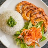 Shrimp Rice · Grilled shrimp  served with white rice and vegetables.