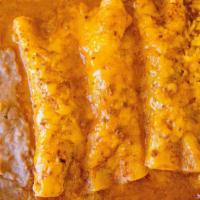 Enchiladas Dinner Plate · 3 enchiladas your choice of filling topped with special gravy and american cheese, served wi...