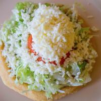 2 Sopes · 2 Homemade com pita with your choice of meat, beans, lettuce, tomatoes, cheese, and sour cre...