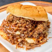 Chopped Beef Sandwich · Chopped, smoked brisket with bbq sauce on a bun.