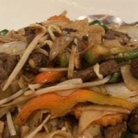 Khee Mao · Spicy stir fried wide noodles with carrots, tomatoes, peppers, pea pods, and onions combined...
