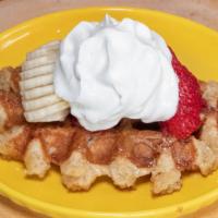 W.C · Fresh strawberries and bananas, speculoos, and whipped cream.