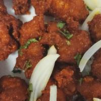 Chicken Lal Mirchi · Chicken white meat mixed with ginger, garlic sauce, and deep fried.