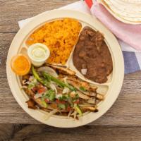 Fajita Platter · Grilled Fajita served with Mexican-Style Rice, Beans, Lettuce & Sour Cream, 3 Tortillas, and...