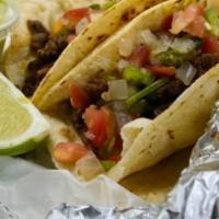 Tacos · Choice of chicken or beef and corn or flour tortilla.