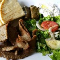 Plates · Lamb or chicken or meatball or fried fish cod served with two dolmas, salad and tzatziki.