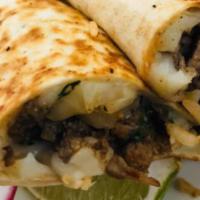 Quesadilla · Flour tortilla with grilled onion and cilantro inside, rice and beans.