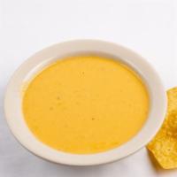 Queso · A delicious blend of cheese and spice.