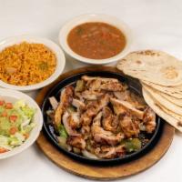 Chicken Fajita Platter · Chicken fajitas with grilled onions.  Served with refried or borracho beans, Mexican rice, g...
