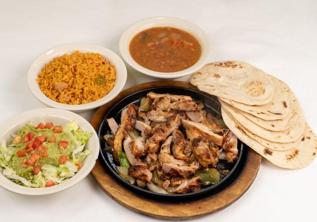 Chicken Fajita Platter · Chicken fajitas with grilled onions.  Served with refried or borracho beans, Mexican rice, guacamole salad, and 8 tortillas. Serves 2-3.