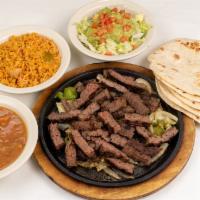 Beef Fajita Platter · Beef fajitas with grilled onions.  Served with refried or borracho beans, Mexican rice, guac...