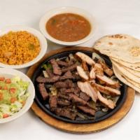 Combo Fajita Platter · Beef and Chicken fajitas with grilled onions.  Served with refried or borracho beans, Mexica...