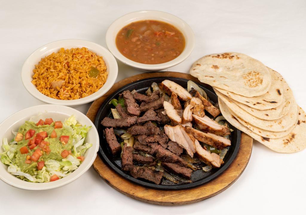 Combo Fajita Platter · Beef and Chicken fajitas with grilled onions.  Served with refried or borracho beans, Mexican rice, guacamole salad, and  6 tortillas. Serves 2-3.