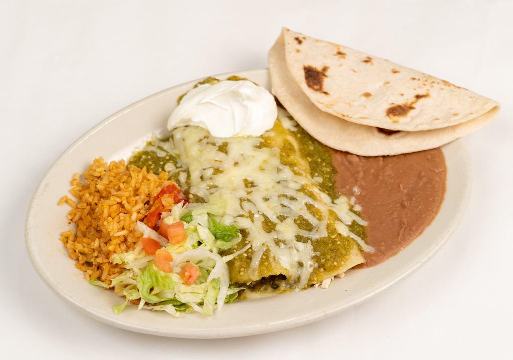 Green Enchiladas · Two chicken enchiladas covered in green salsa and topped with melted monterey jack cheese.