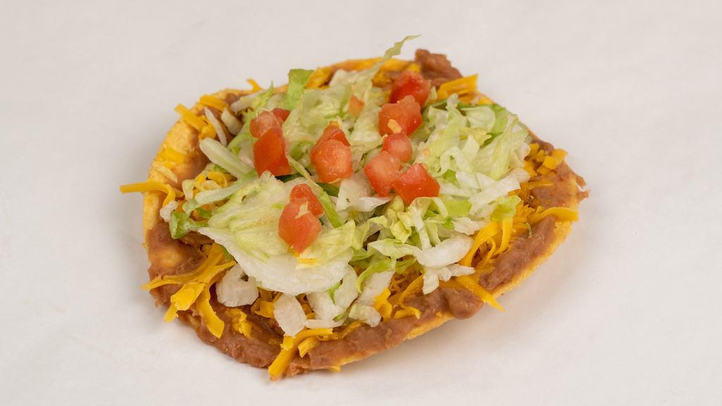 Bean & Cheese Chalupa · Made on a corn tortilla shell with refried beans. Topped with lettuce, tomato, and cheese.