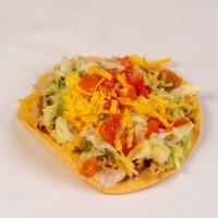 Chicken Chalupa · Made on a corn tortilla shell with refried beans and stewed chicken. Topped with lettuce, ch...