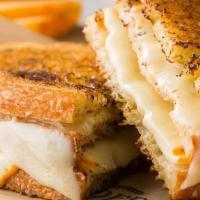Sandwich | Provolone Muenster Cheese Melt · Three layers of French Country Sourdough bread with muenster cheese, provolone cheese and fr...