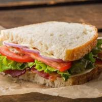 Sandwich | Classic Café Sandwich · Kneaders sauce, provolone cheese, lettuce, tomatoes, red onions, salt & pepper. May be serve...