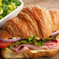 Croissant | Café Sandwich · Kneaders sauce, provolone cheese, lettuce, tomatoes, red onions, salt & pepper on a whole cr...