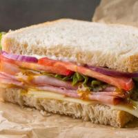 Sandwich | Ham And Swiss Café Sandwich · Honey mustard, mayonnaise, Swiss cheese, lettuce, tomatoes, red onions, salt and pepper. May...