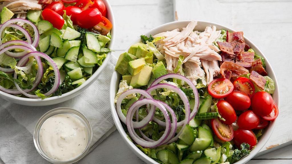 Turkey Bacon Avocado Salad · Kneaders greens, slow-roasted hand-pulled turkey, crispy bacon, tomatoes, cucumbers, red onions, avocado, salt & pepper with ranch dressing on the side. Served with a slice of bread, croutons or roll.