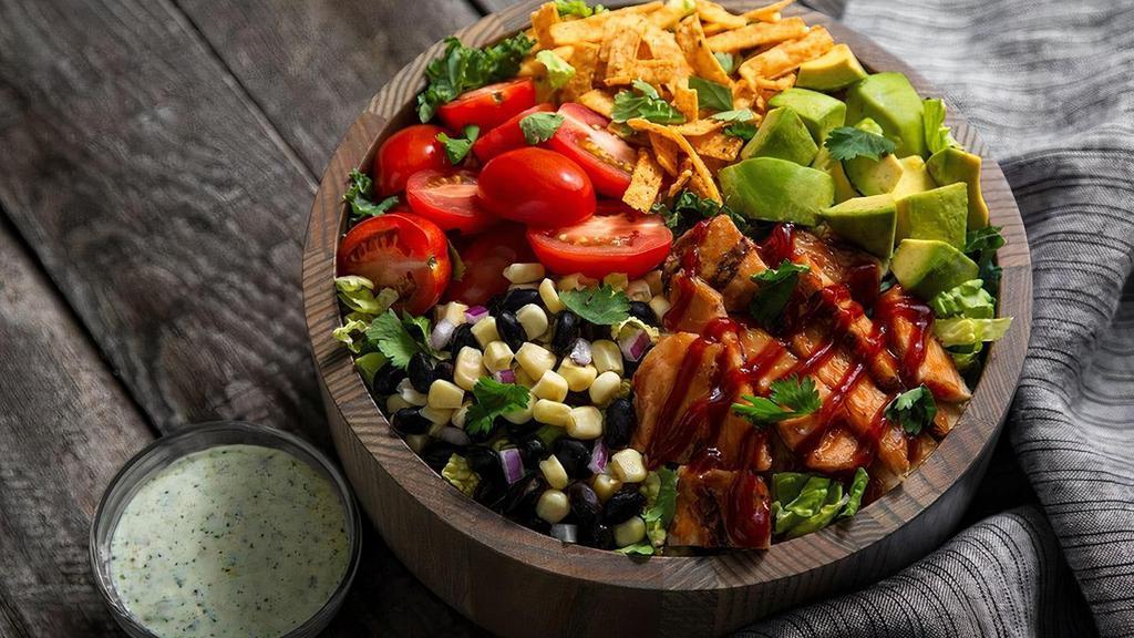 Southwest Bbq Chicken · Kneaders greens, grilled BBQ chicken, fresh cilantro, tomatoes, black beans, avocado, red onion,  corn, salt & pepper with a Cotijo Cilantro dressing on the side. Served with crisp tortilla strips over the top.