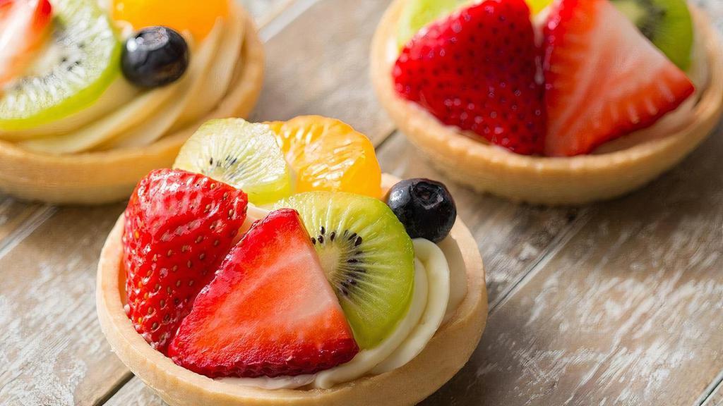 Fruit Tart · Shortbread tart shell imported from Switzerland with raspberry currant marmalade, imported Swiss vanilla mousse, fresh fruit, and apricot glaze.