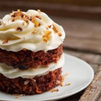 Petite Carrot Cake · Our moist carrot cake loaded with pecans and raisins, decorated with homemade cream cheese i...