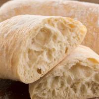 Ciabatta · A favorite at the bakery; the thin crust and moist, open grain interior create the perfect d...