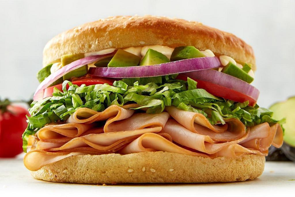 Avocado Turkey Sandwich · turkey | avocado | lettuce | onion | tomato | lite mayo | sourdough bun.