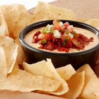 Chili Con Queso  · Chili, melted white cheddar, young guns hatch chiles, house-made pico de gallo, house-made t...