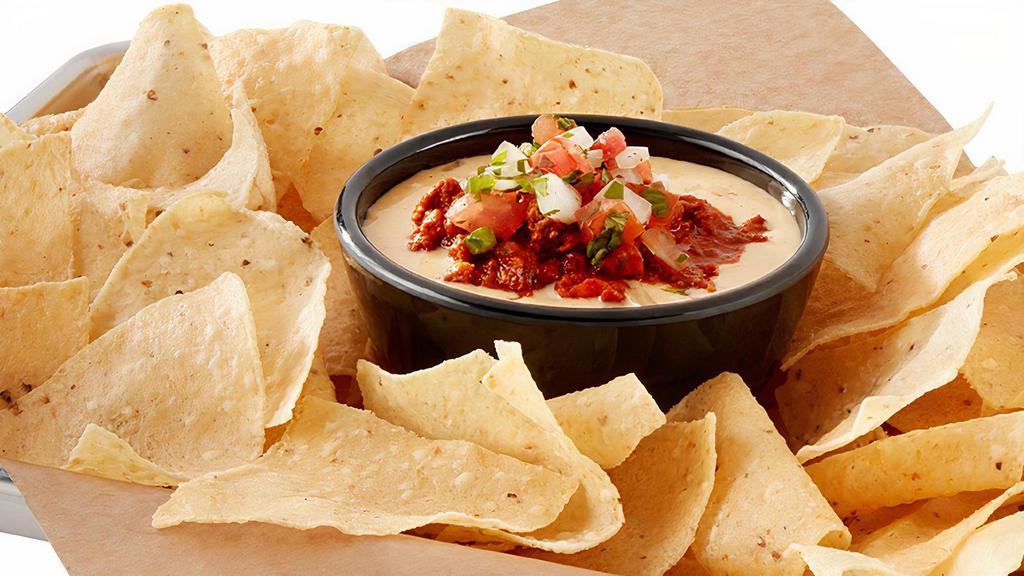Chili Con Queso  · Chili, melted white cheddar, young guns hatch chiles, house-made pico de gallo, house-made tortilla chips, serves 6-8.