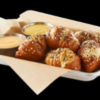 Everything Pretzel Knots  · Pretzel knots, everything seasoning, new Belgium fat tire® beer cheese, honey mustard, serve...