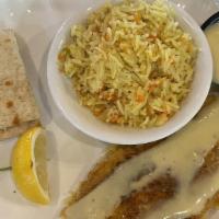 Wild Caught Atlantic Haddock · Fried or grilled. Served with rice pilaf and vegetables.