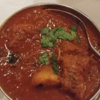 Chicken Vindaloo · Tender cubes of chicken and potato stewed together in Goan style red-hot curry.