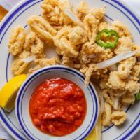 Calamari · Lightly breaded and fried calamari served with jalapeños and onions and homemade spicy marin...