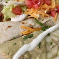 Texas Combo · Texas favorite combination of a chicken enchilada, a crispy taco and a beef taco al carbon s...
