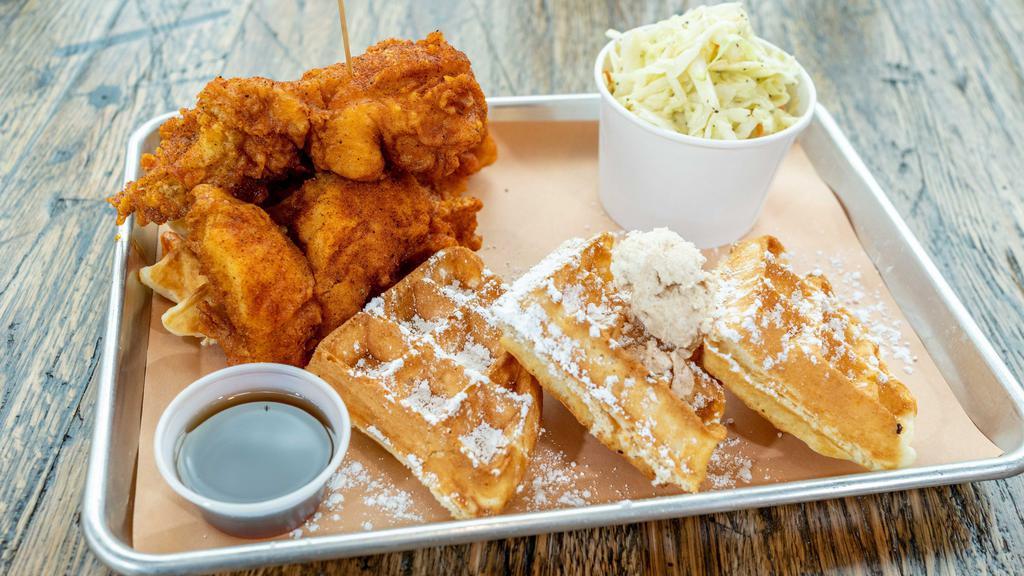 Chicken And Waffles · 3 tenders, Belgian waffle, powdered sugar, crack butter, maple syrup, choice of one side and a dipping sauce.