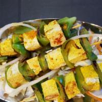 Paneer Satay · Gluten-free. Indian cottage cheese skewered and sautéed with garlic sauce.