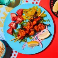 Tandoori Shrimp · Gluten-free. Shrimp marinated in yogurt, ginger, garlic, lemon juice, herbs and spices.