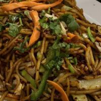 Schezwan Hakka Noodles · Gluten-free. Stir fried rice noodles with onion, carrot, bell peppers in chili garlic sauce.