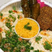 Vegetarian Plate · Served with rice, tabouleh salad, hummus, baba ganoush, domas, falafel, pita bread, and tzat...